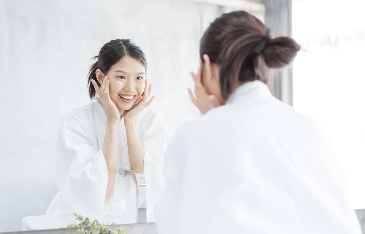 Quiet morning skincare moment before the mirror